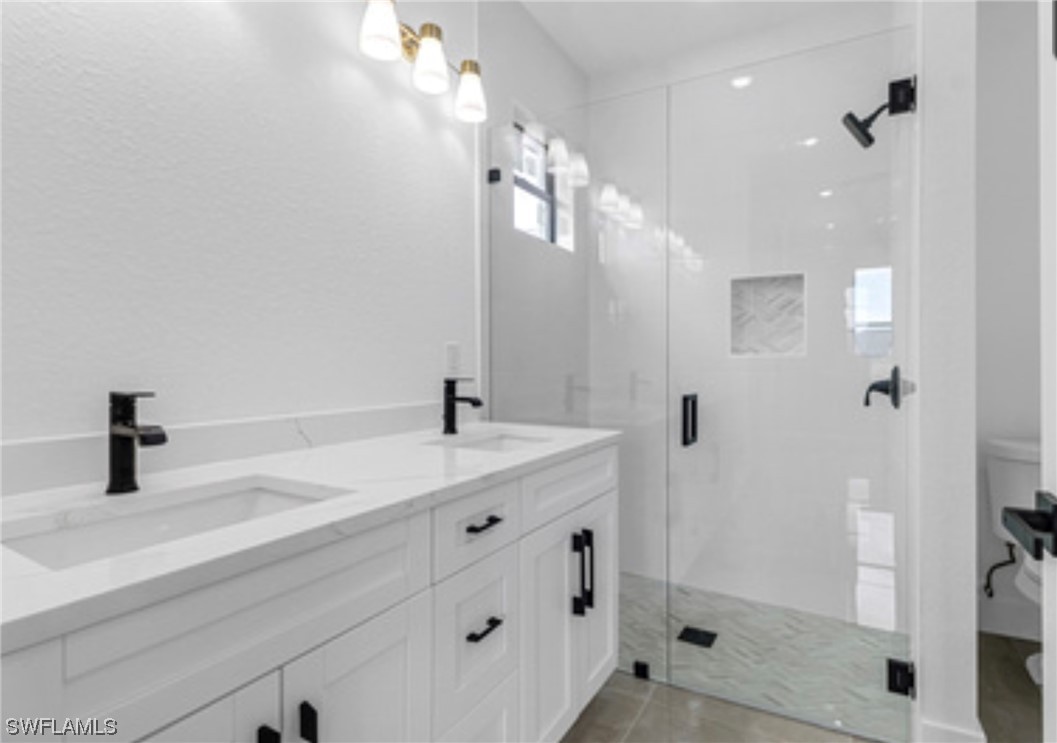 2607 4th Street Southwest Lehigh Acres, FL 33976 - Photo 14 of 21 a bathroom with a sink and a mirror