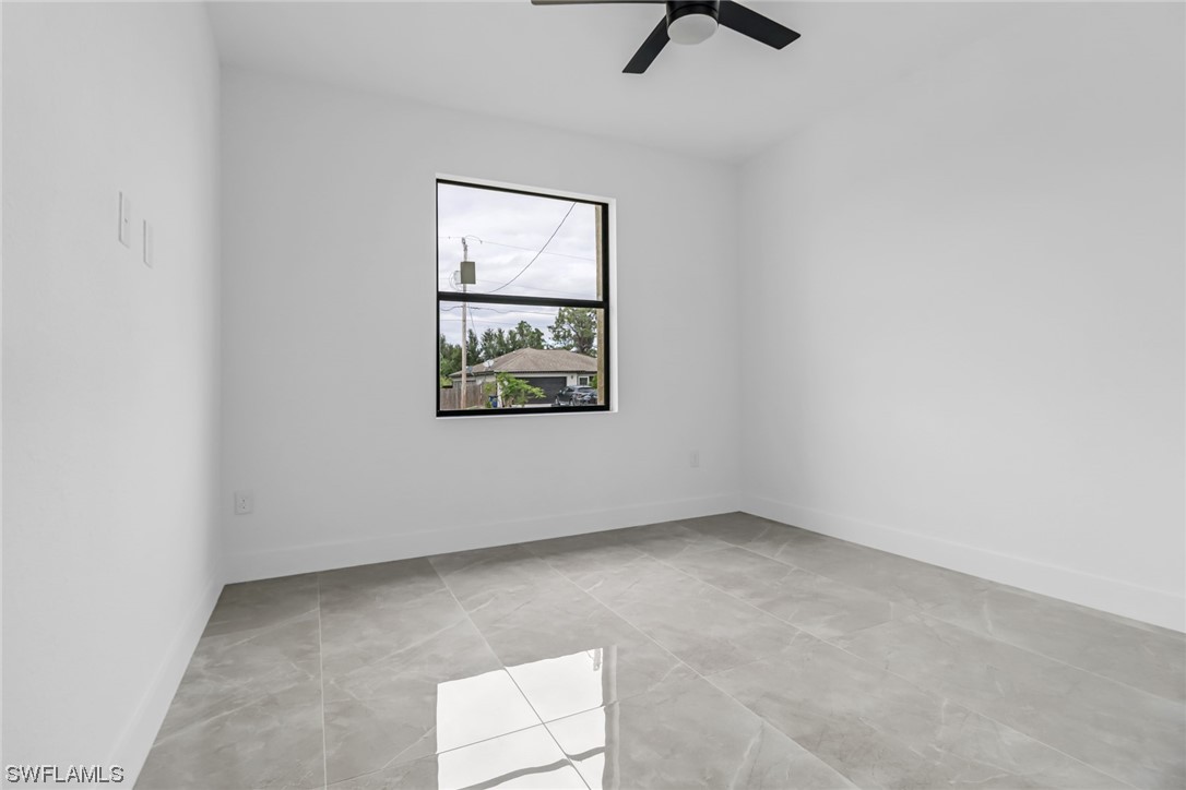 2607 4th Street Southwest Lehigh Acres, FL 33976 - Photo 18 of 21 an empty room with a window
