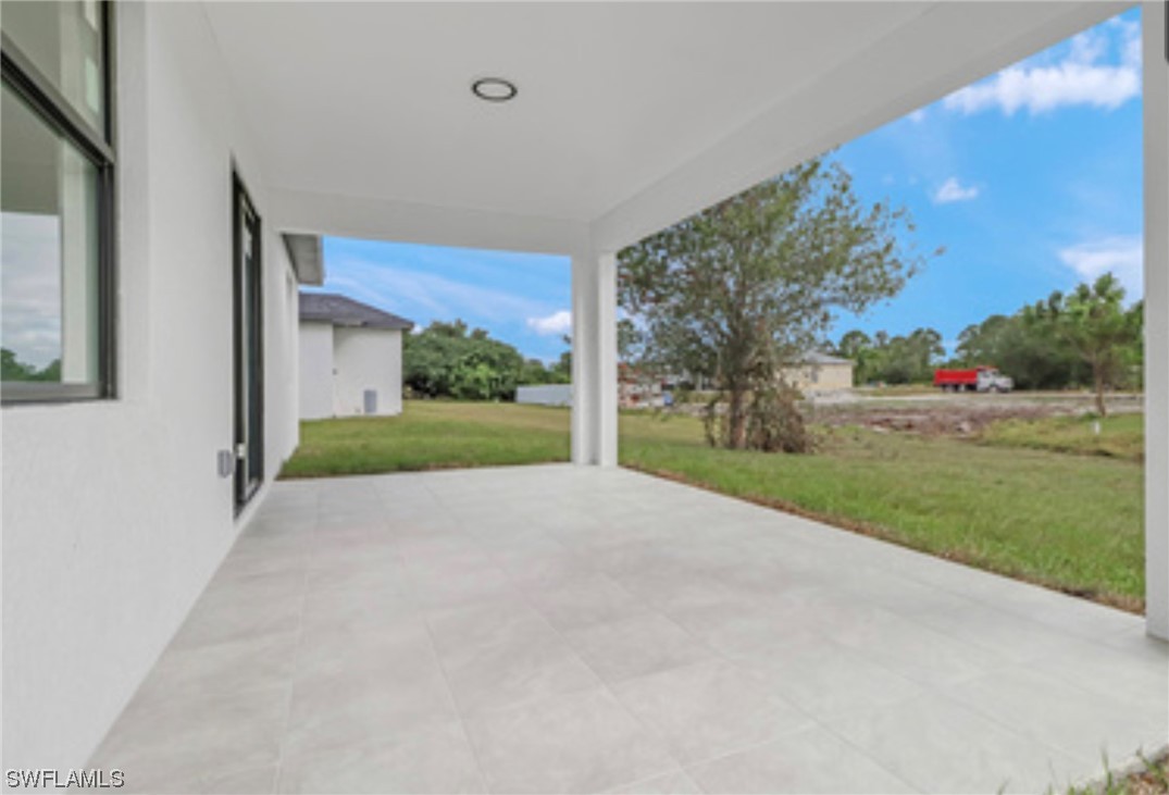 2607 4th Street Southwest Lehigh Acres, FL 33976 - Photo 20 of 21 a view of a house with a yard