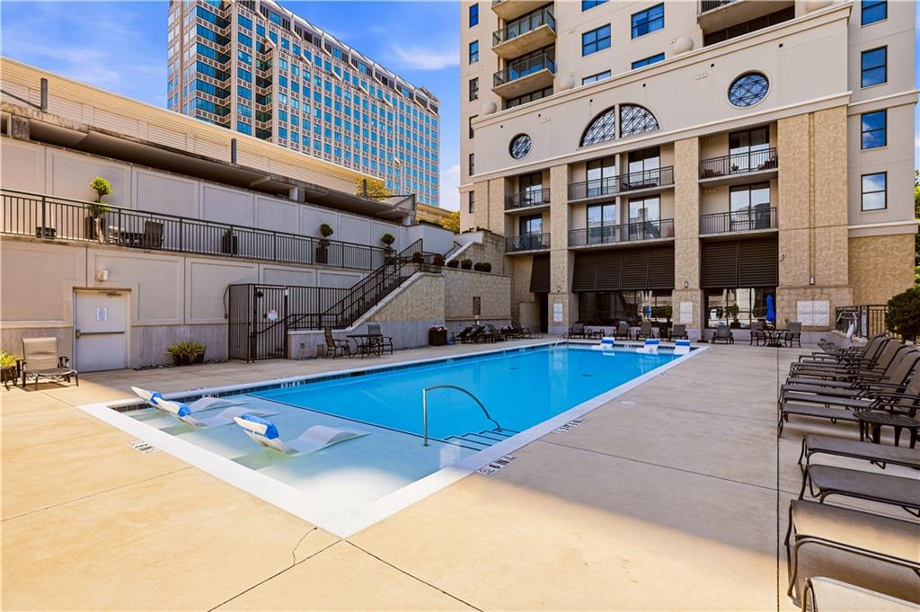 3040 Peachtree Road Northwest, Unit 1503 Atlanta, GA 30305 - Photo 35 of 38 a view of a building with cars park