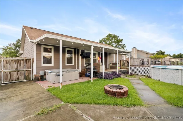 a front view of a house with a yard table and chairs