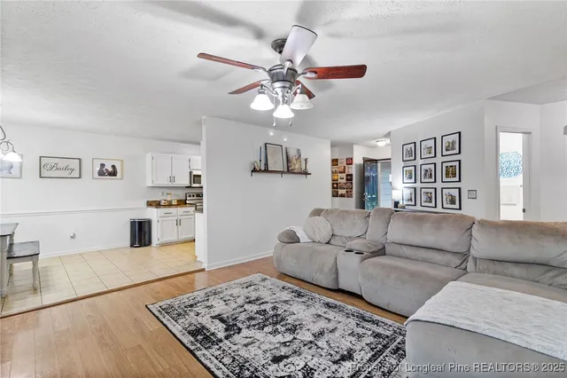a living room with furniture and a rug