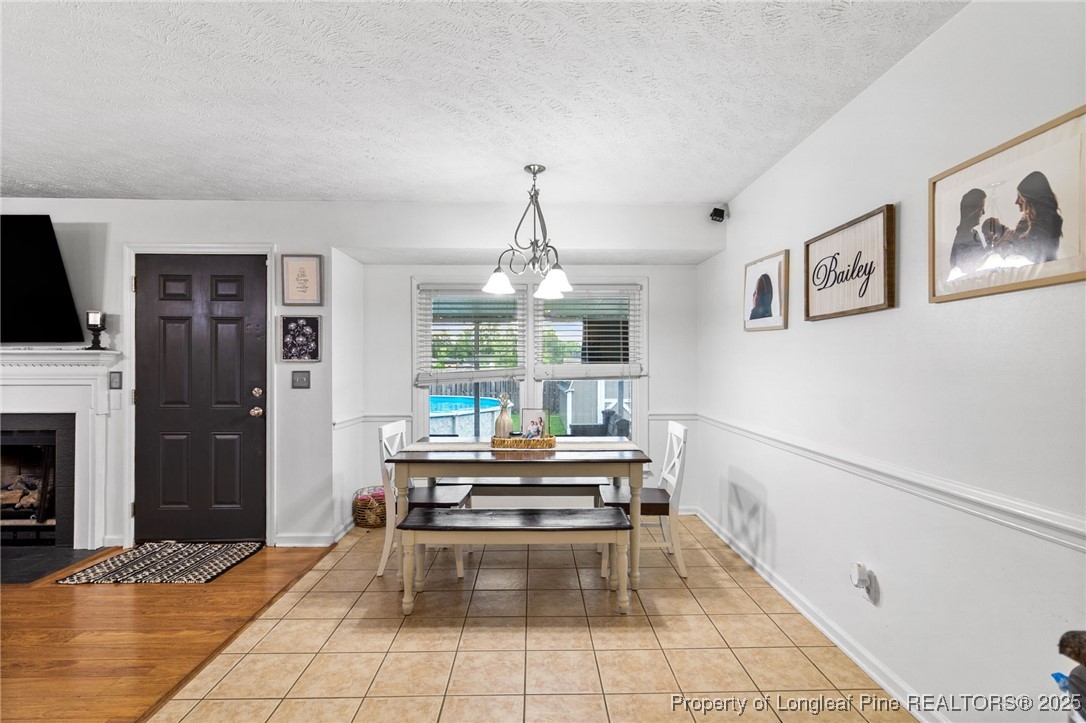 4213 Buckhurst Drive Hope Mills, NC 28348 - Photo 7 of 27 a living room with furniture and a fireplace
