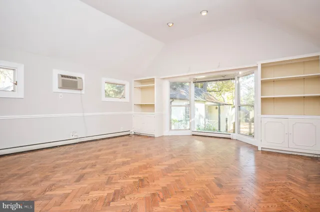 a view of an empty room with a window