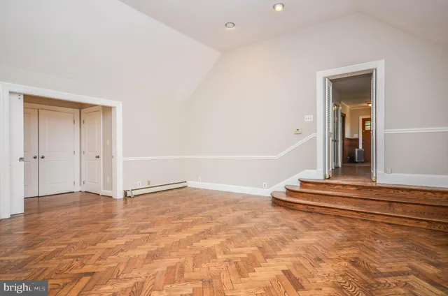 a view of an empty room with a window