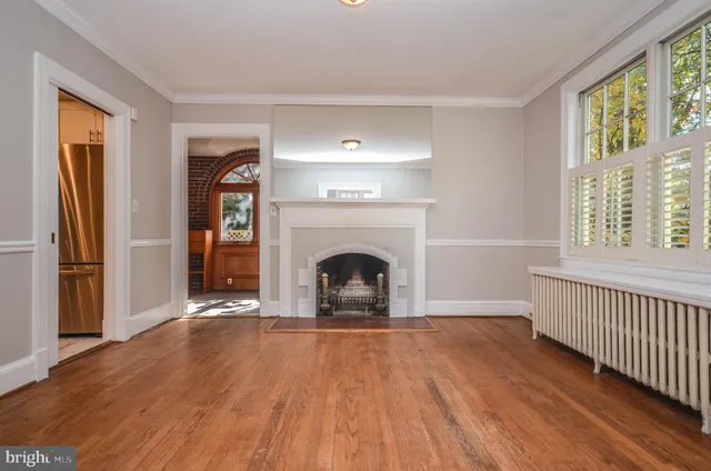a view of an entryway with wooden floor