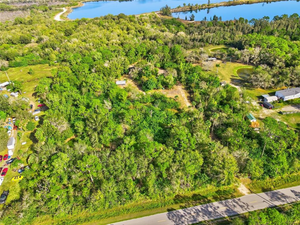 39970 Little Farm Road Punta Gorda, FL 33982 - Photo 17 of 20 a view of a large yard with green space