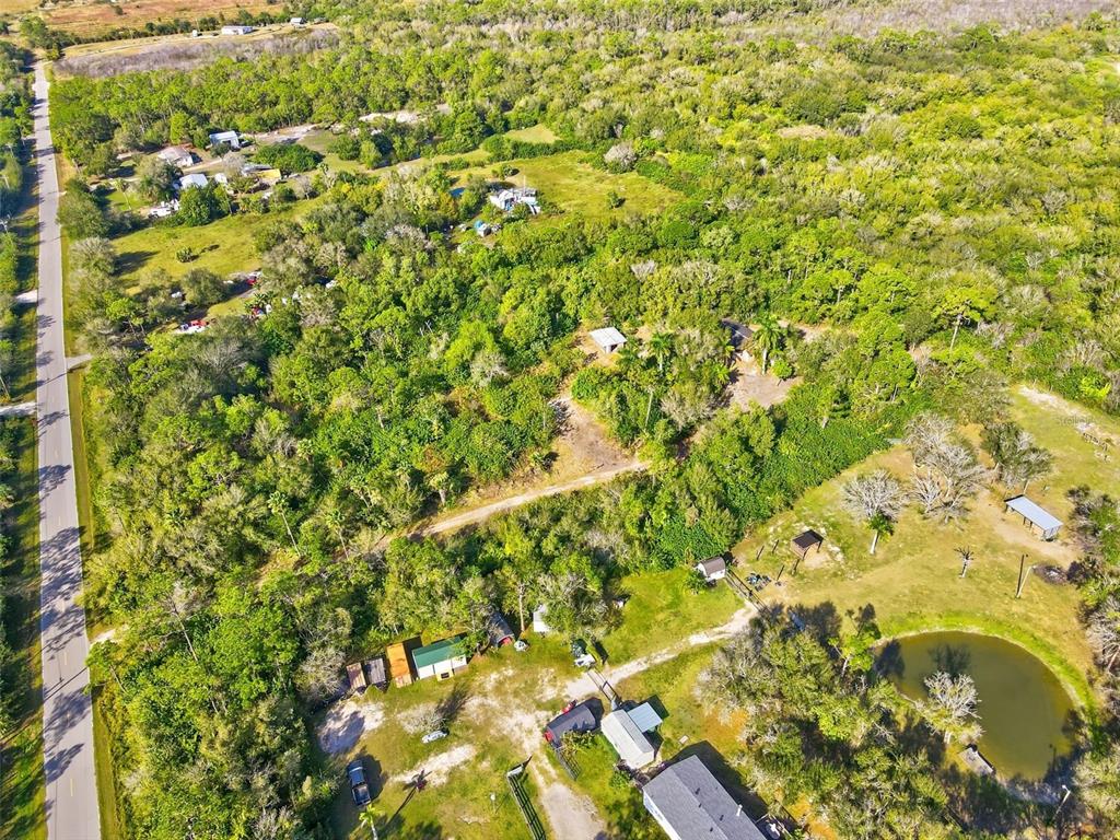 39970 Little Farm Road Punta Gorda, FL 33982 - Photo 4 of 20 a view of a big yard of the house