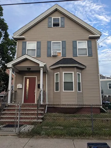 a front view of a house with yard