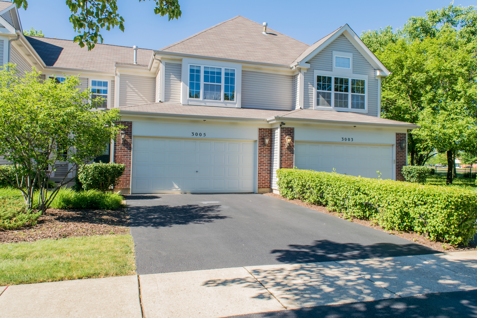 3005 Crystal Rock Road Naperville, IL 60564 - Photo 1 of 31 a front view of a house with a yard and garage