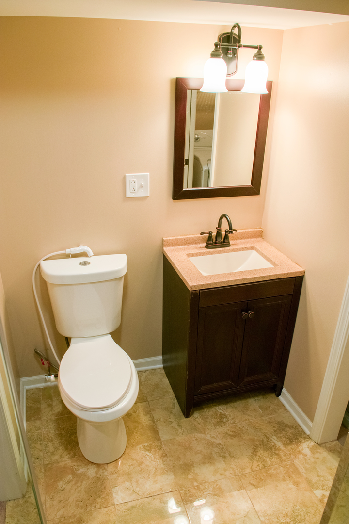 3005 Crystal Rock Road Naperville, IL 60564 - Photo 29 of 31 a bathroom with a toilet sink and mirror