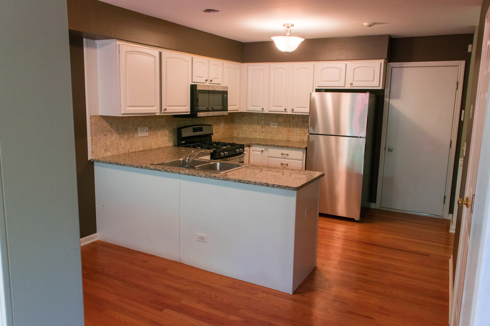 3005 Crystal Rock Road Naperville, IL 60564 - Photo 5 of 31 a kitchen with stainless steel appliances a refrigerator sink microwave and cabinets