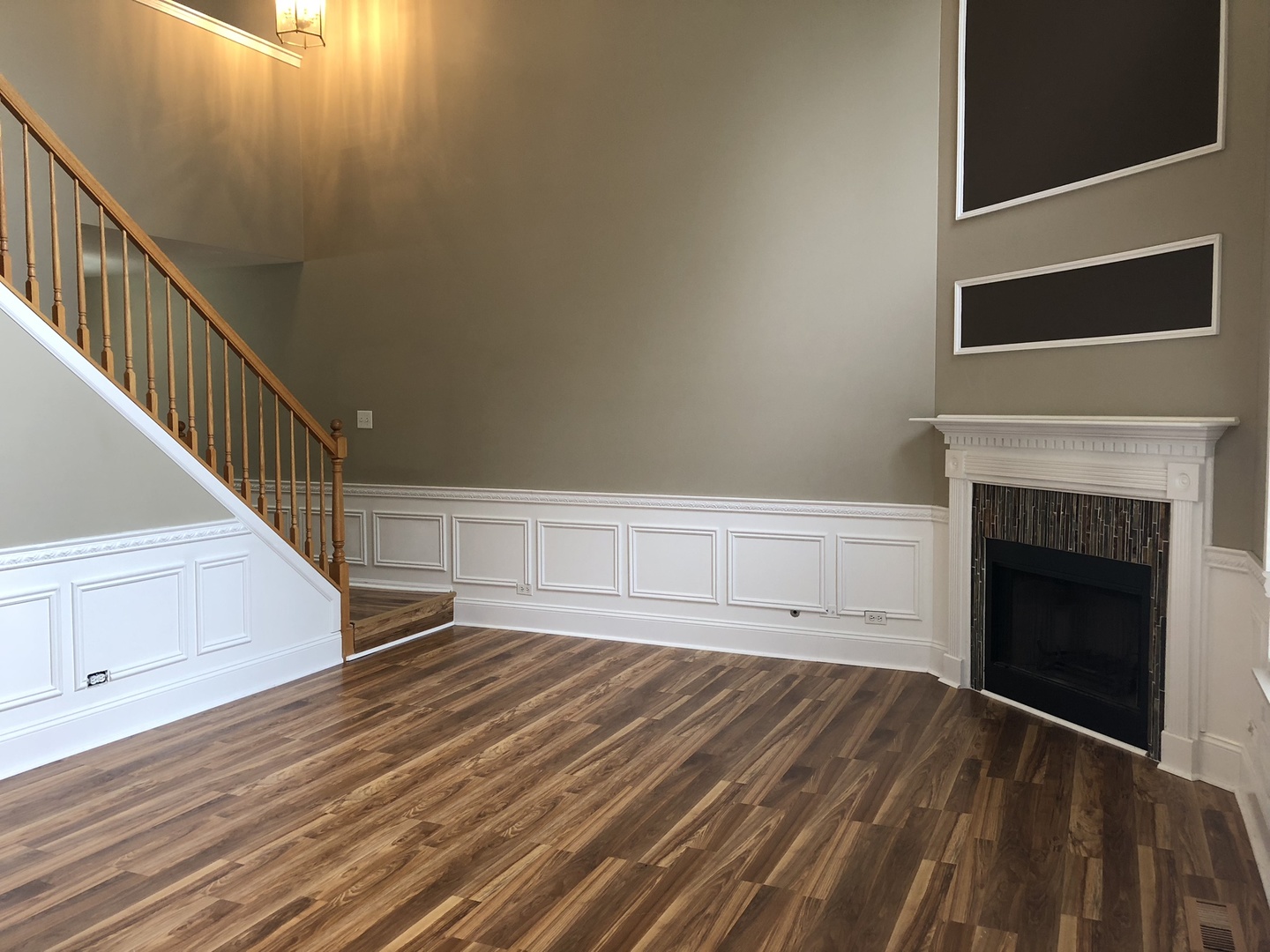 3005 Crystal Rock Road Naperville, IL 60564 - Photo 10 of 31 a view of an empty room with wooden floor and a fireplace