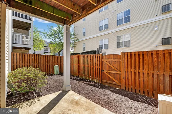 a outdoor living space with patio furniture and garden