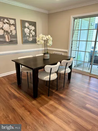 a living room with furniture a fireplace and a window