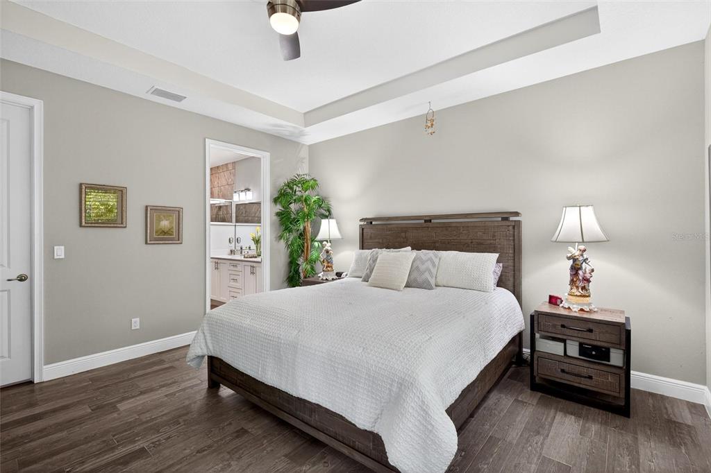 66 Wrendale Loop Ormond Beach, FL 32174 - Photo 18 of 88 a bedroom with a bed a lamp on the table and a window