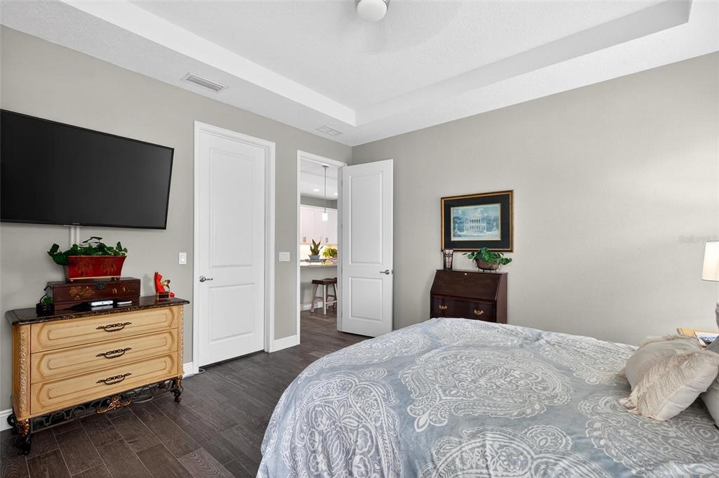66 Wrendale Loop Ormond Beach, FL 32174 - Photo 31 of 88 a bedroom with a bed and a flat tv screen in it