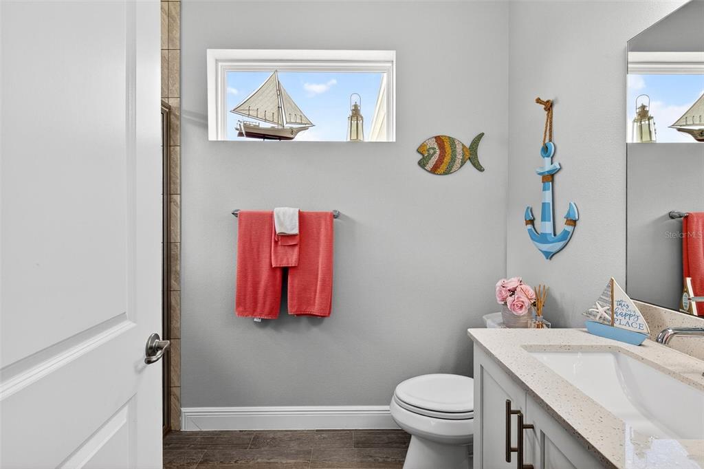 66 Wrendale Loop Ormond Beach, FL 32174 - Photo 33 of 88 a bathroom with a sink mirror vanity and toilet