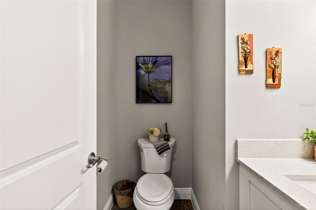 66 Wrendale Loop Ormond Beach, FL 32174 - Photo 38 of 88 a white toilet sitting next to a bathroom sink and tub