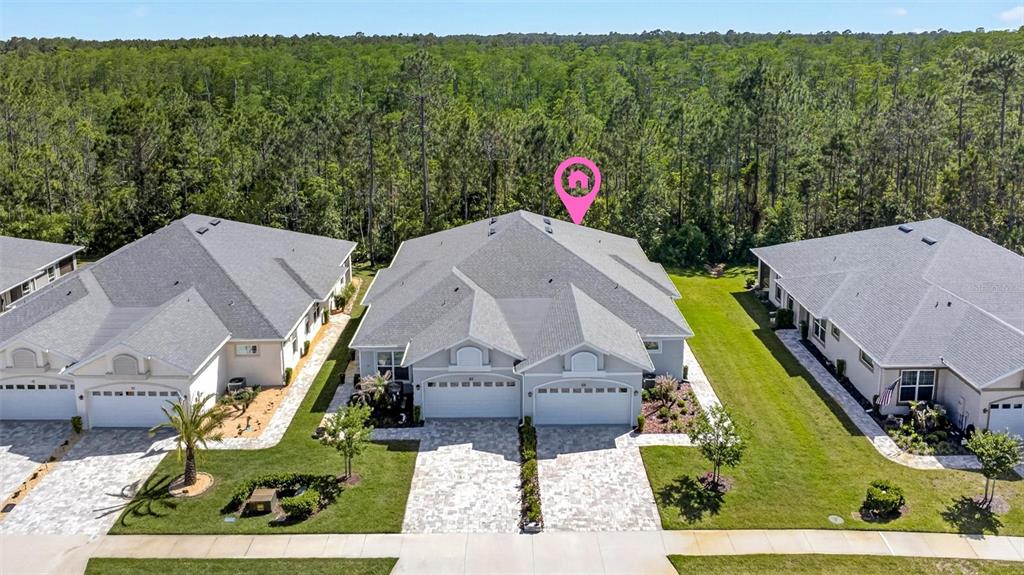 66 Wrendale Loop Ormond Beach, FL 32174 - Photo 46 of 88 an aerial view of a house with a garden and trees
