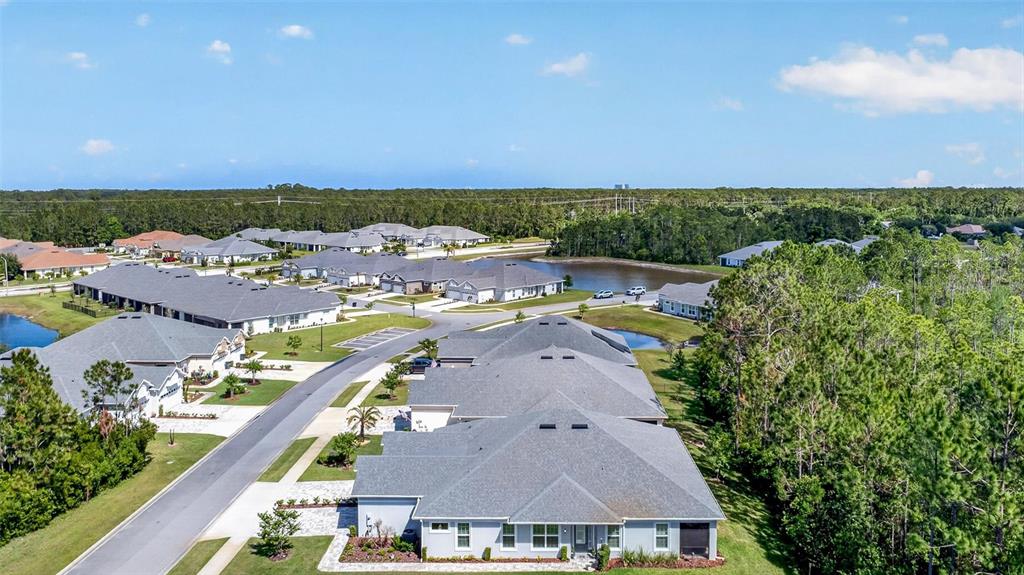 66 Wrendale Loop Ormond Beach, FL 32174 - Photo 52 of 88 an aerial view of a house with a garden