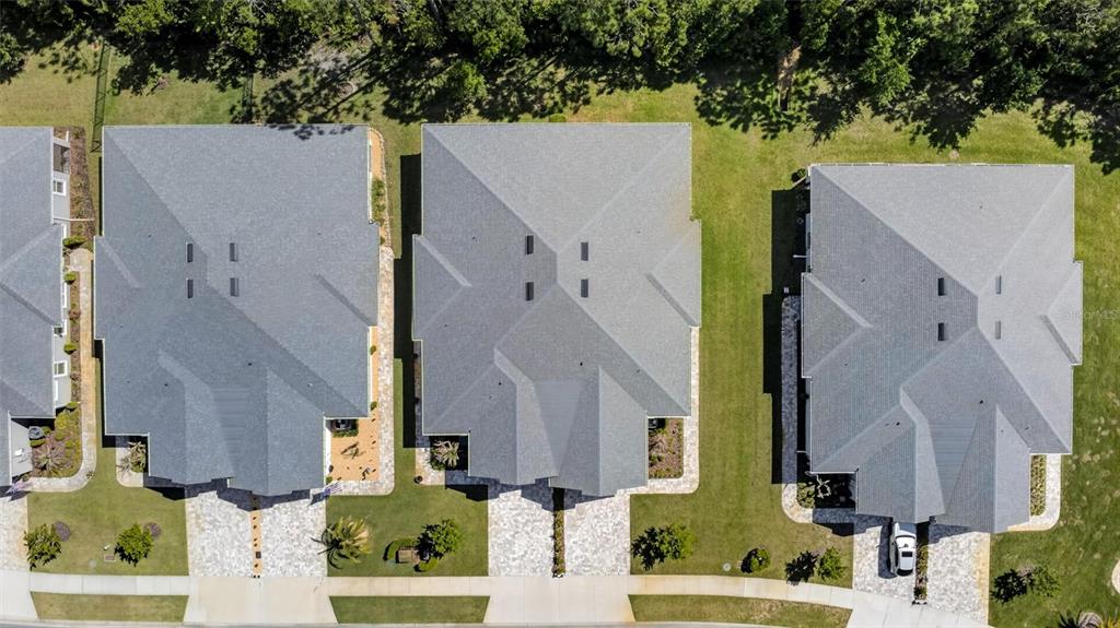 66 Wrendale Loop Ormond Beach, FL 32174 - Photo 57 of 88 an aerial view of multiple house with a yard