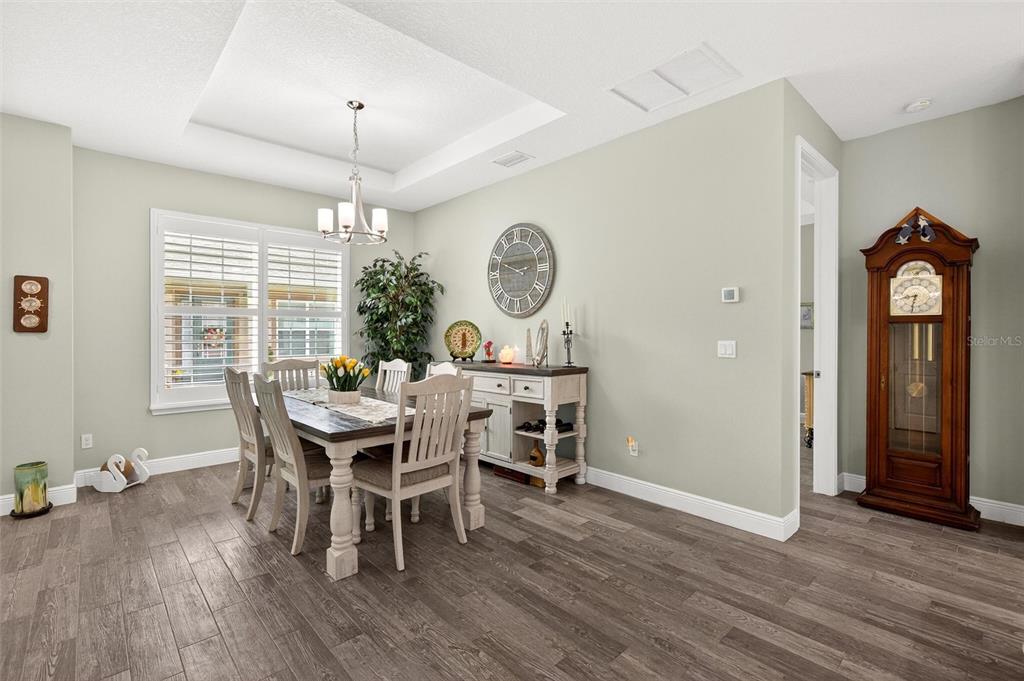 66 Wrendale Loop Ormond Beach, FL 32174 - Photo 8 of 88 a view of a dining room with furniture window and wooden floor