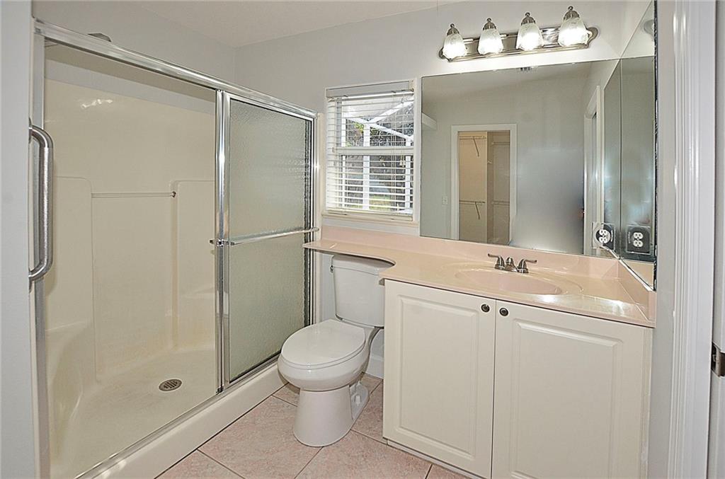 3285 3rd Place Vero Beach, FL 32968 - Photo 21 of 34 a bathroom with a sink a toilet and shower