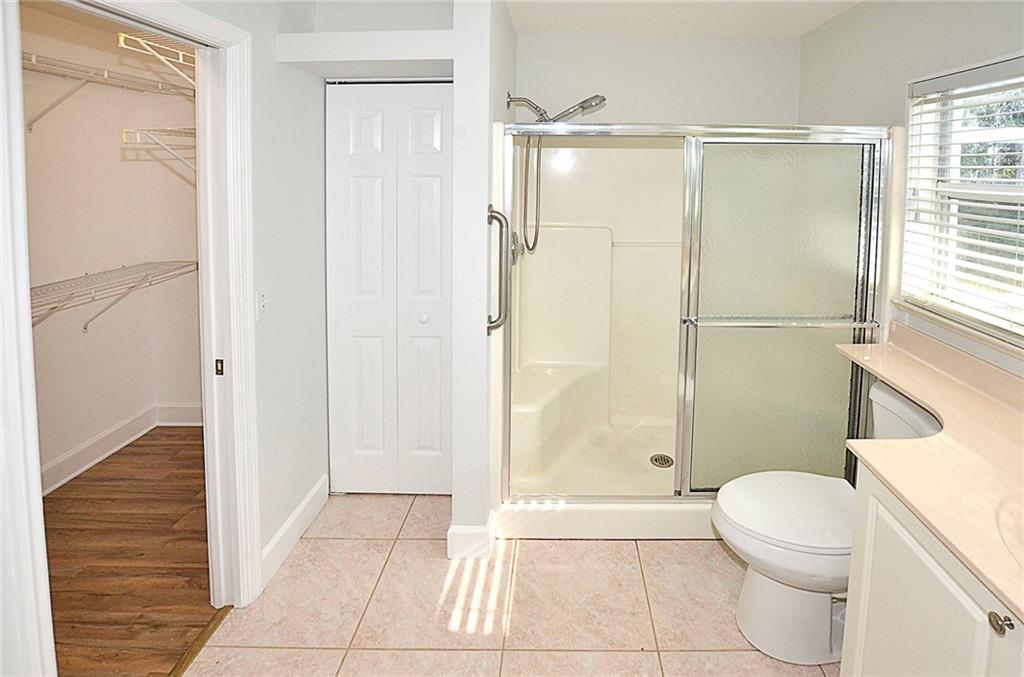 3285 3rd Place Vero Beach, FL 32968 - Photo 22 of 34 a bathroom with a shower a toilet and a shower