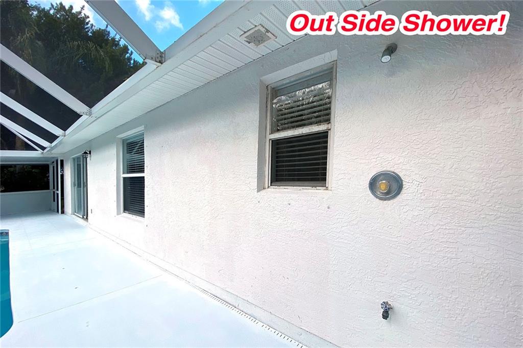 3285 3rd Place Vero Beach, FL 32968 - Photo 30 of 34 a street sign on a wall next to a building