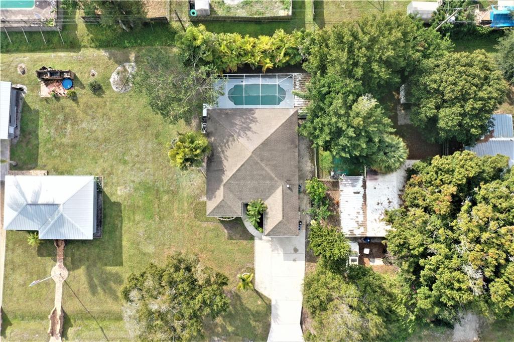 3285 3rd Place Vero Beach, FL 32968 - Photo 33 of 34 an aerial view of a house with a yard and garden