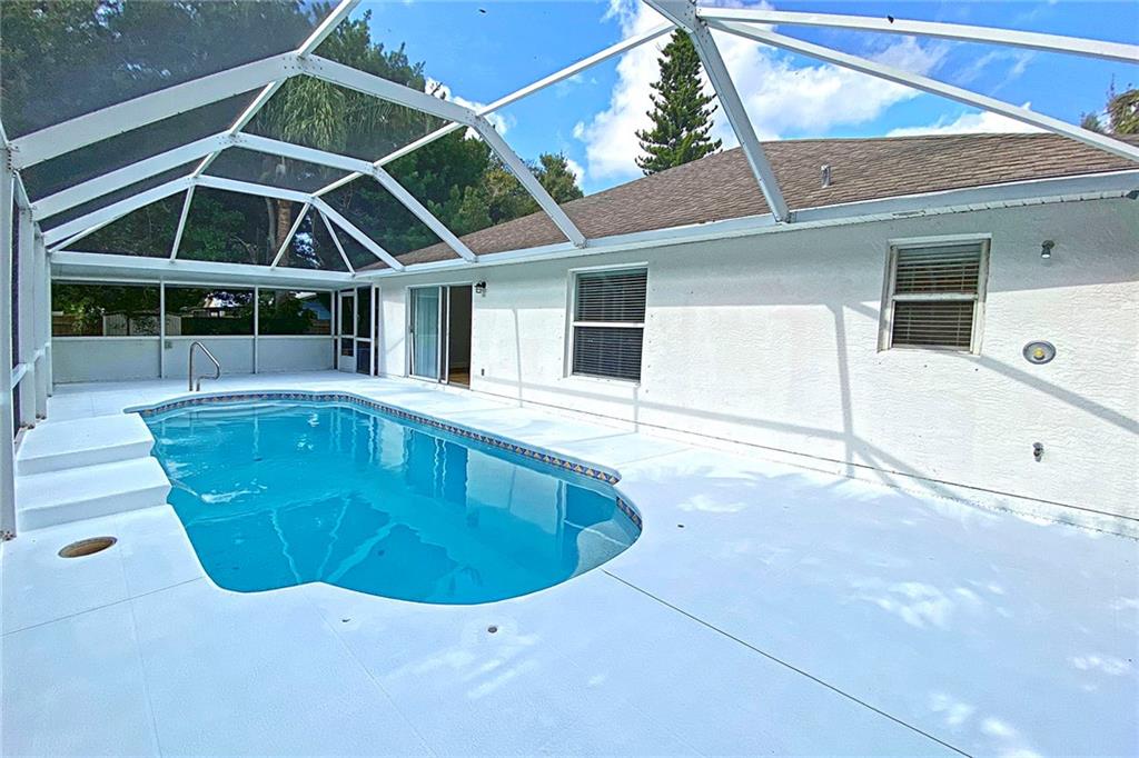 3285 3rd Place Vero Beach, FL 32968 - Photo 6 of 34 a view of a house with a swimming pool