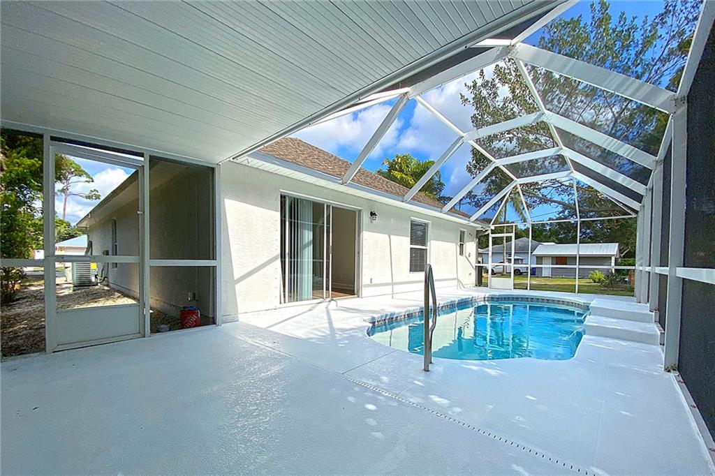 3285 3rd Place Vero Beach, FL 32968 - Photo 8 of 34 a view of a house with a swimming pool