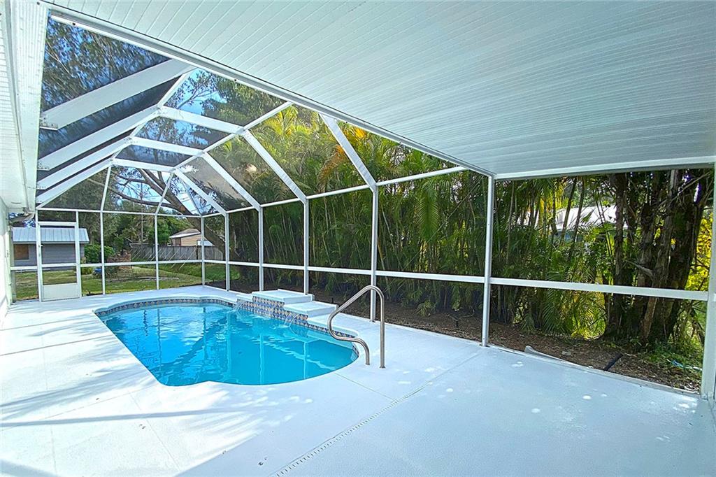 3285 3rd Place Vero Beach, FL 32968 - Photo 9 of 34 a view of a swimming pool with a tub