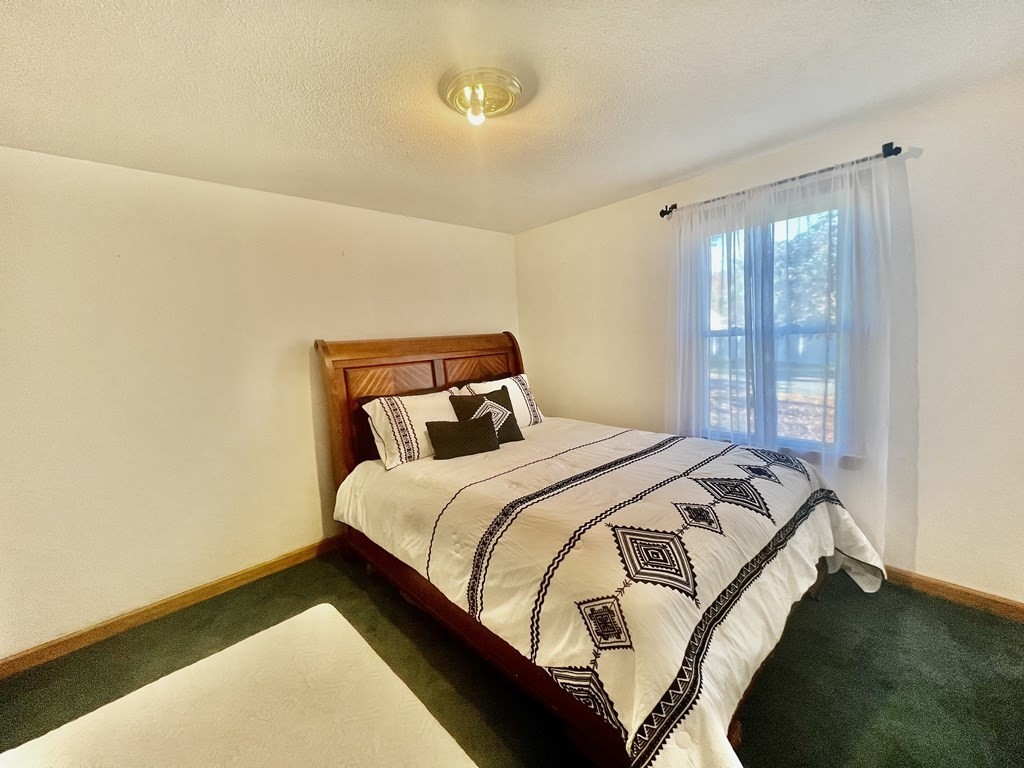 140 Ellendale Circle Springfield, MA 01128 - Photo 12 of 21 a bedroom with a bed and window