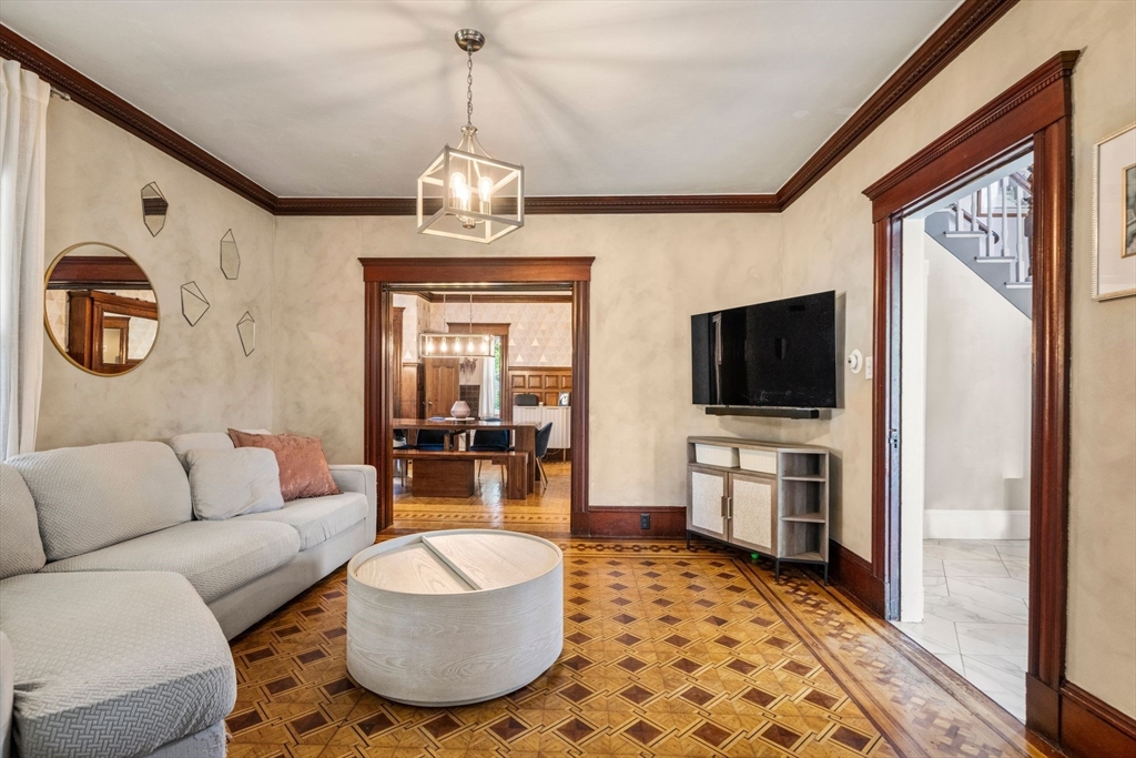 18 Mill Street Boston, MA 02122 - Photo 12 of 38 a living room with furniture and a flat screen tv