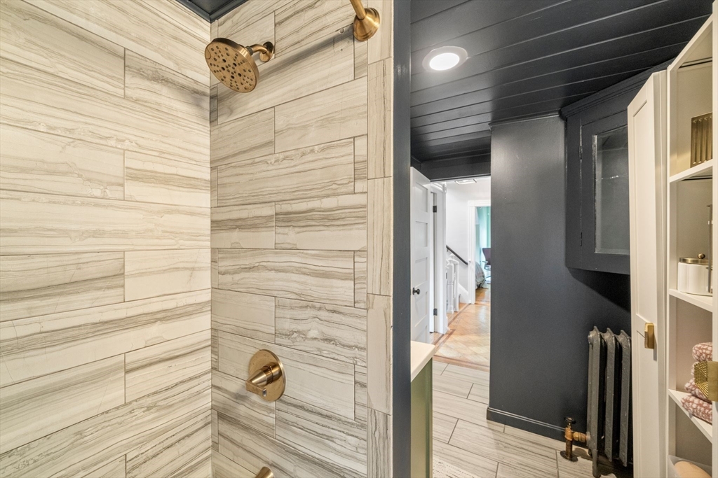 18 Mill Street Boston, MA 02122 - Photo 19 of 38 a bathroom with a shower