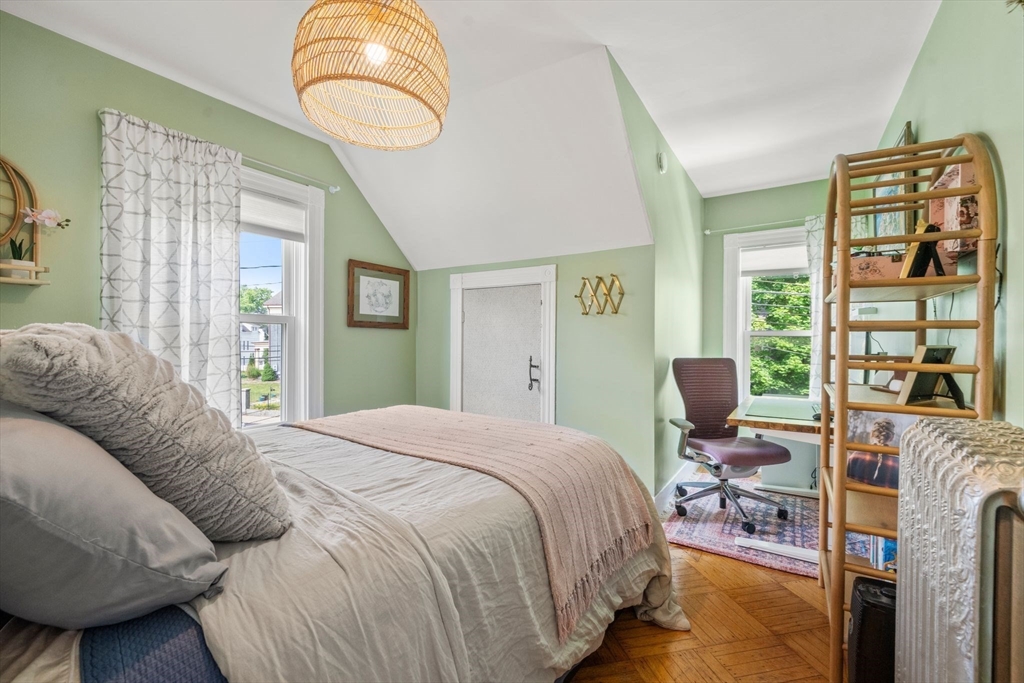 18 Mill Street Boston, MA 02122 - Photo 20 of 38 a bedroom with a bed dresser and a window