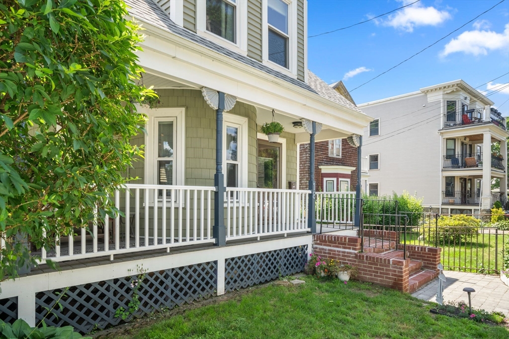 18 Mill Street Boston, MA 02122 - Photo 2 of 38 a front view of a house with a garden