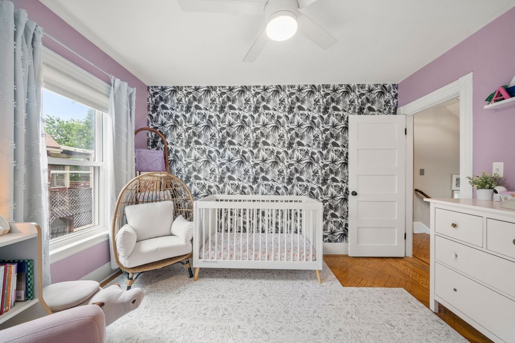 18 Mill Street Boston, MA 02122 - Photo 21 of 38 a bedroom with furniture and a window