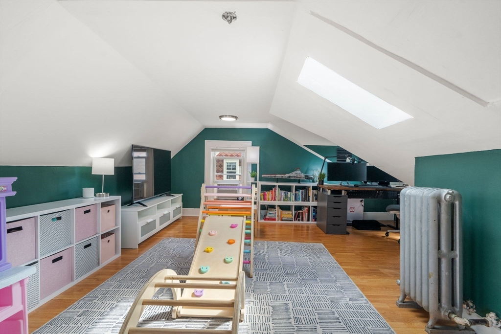 18 Mill Street Boston, MA 02122 - Photo 23 of 38 a living room with furniture and a flat screen tv