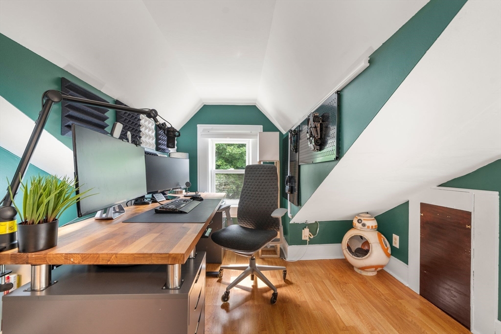 18 Mill Street Boston, MA 02122 - Photo 25 of 38 a living room with furniture and a wooden floor