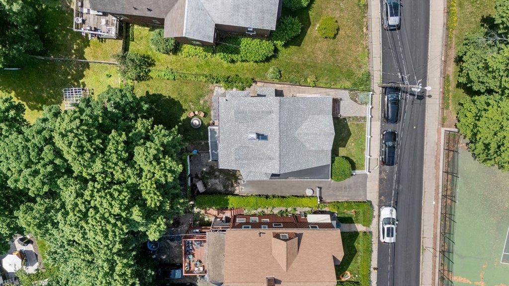 18 Mill Street Boston, MA 02122 - Photo 36 of 38 an aerial view of a house with a yard and garden space