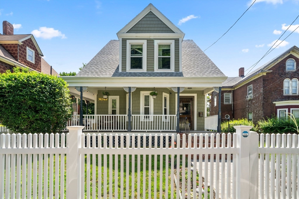 18 Mill Street Boston, MA 02122 - Photo 4 of 38 a front view of a house with a garden