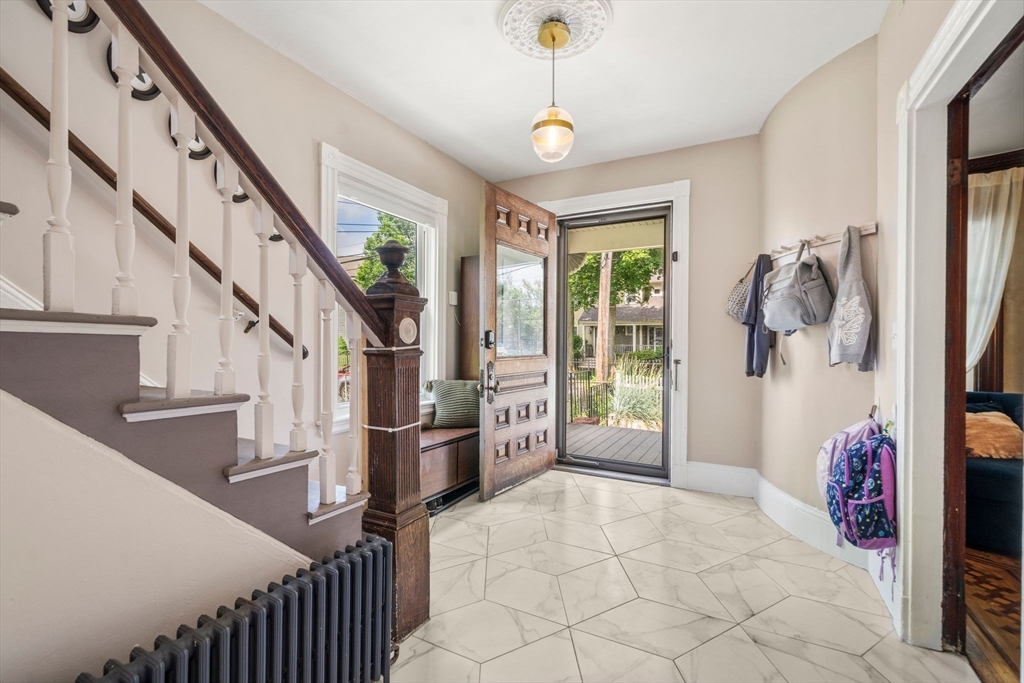 18 Mill Street Boston, MA 02122 - Photo 5 of 38 a view of entryway and hall with wooden floor