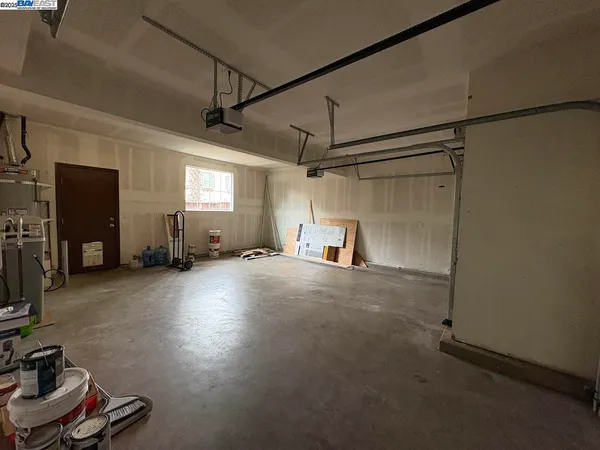 a view of a storage & utility room with two washing machine