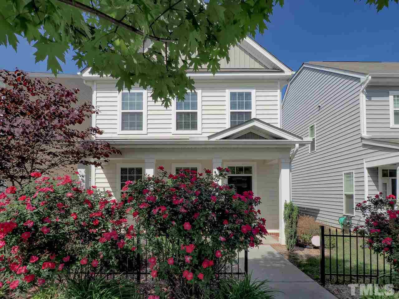 a view of a house with a flower garden