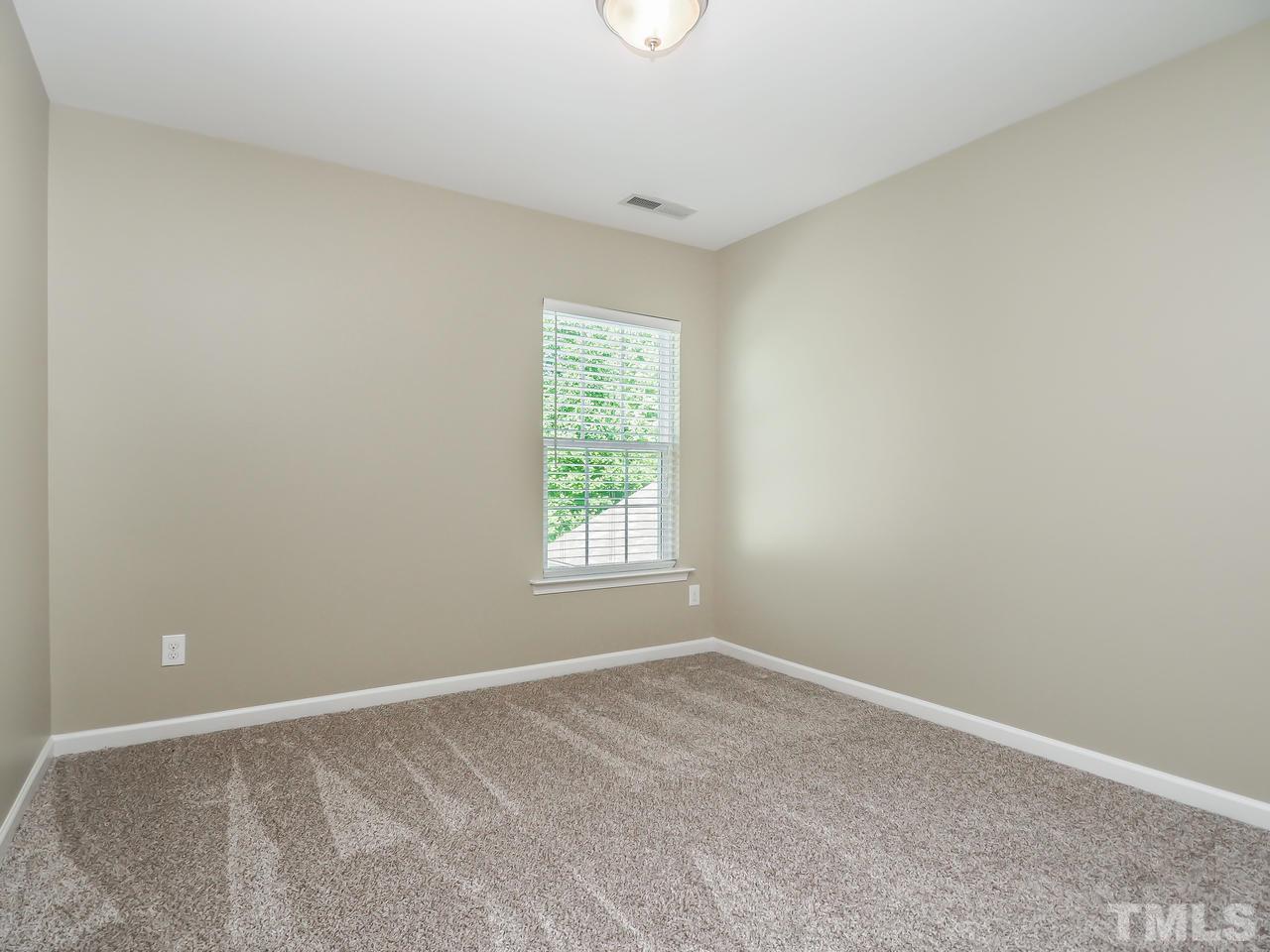 934 Ileagnes Road Raleigh, NC 27603 - Photo 13 of 23 an empty room with a window