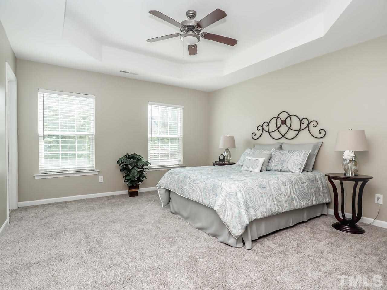 934 Ileagnes Road Raleigh, NC 27603 - Photo 15 of 23 a spacious bedroom with a bed and window