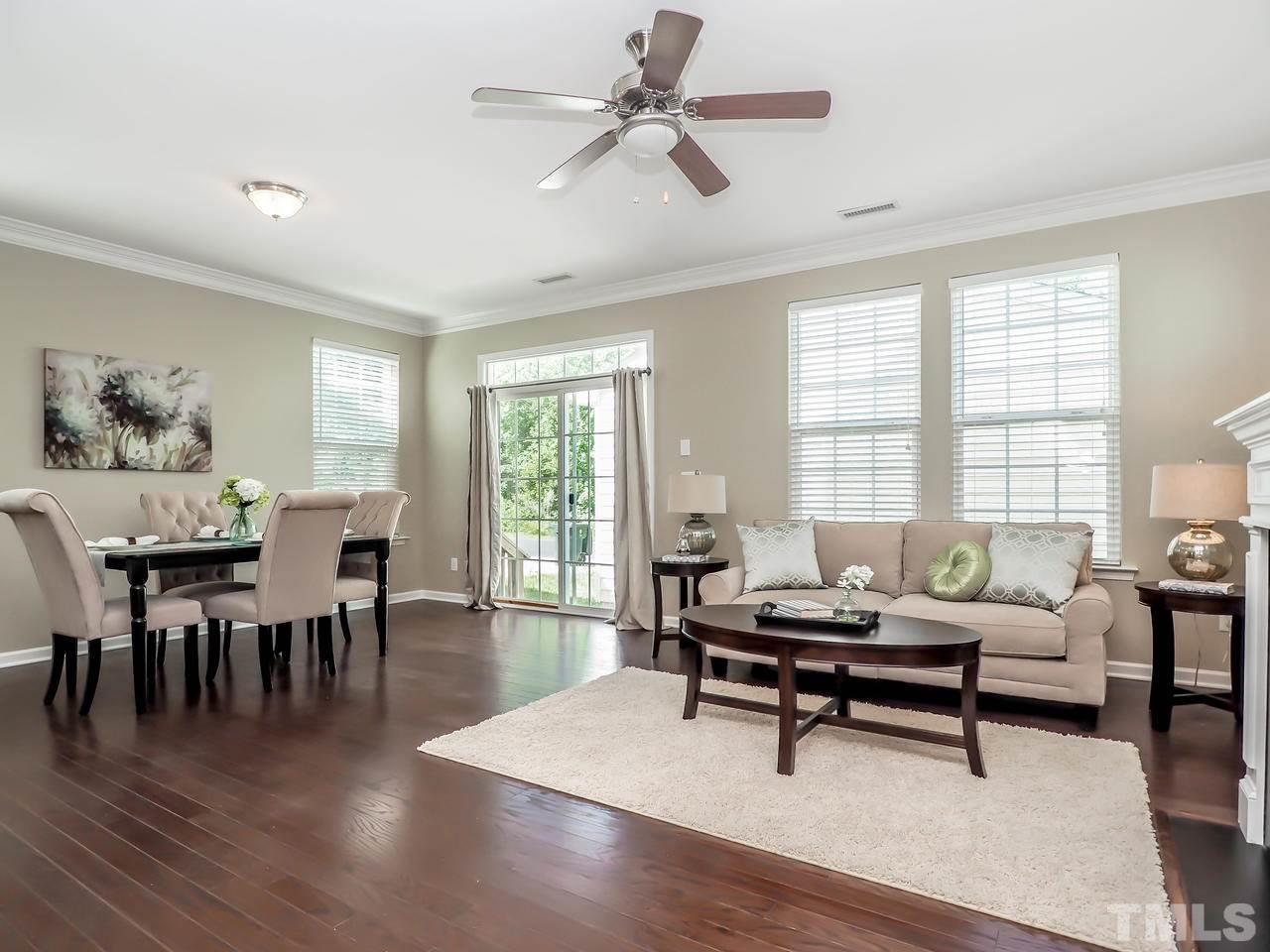 934 Ileagnes Road Raleigh, NC 27603 - Photo 18 of 23 a living room with furniture a wooden floor and a window